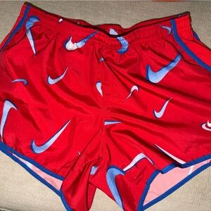 Nike Girl’s Red Athletic Shorts with Blue and White Swooshes